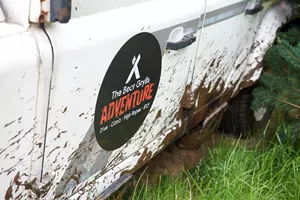 The Bear Grylls Adventure logo on Land Rover outside attraction main entrance