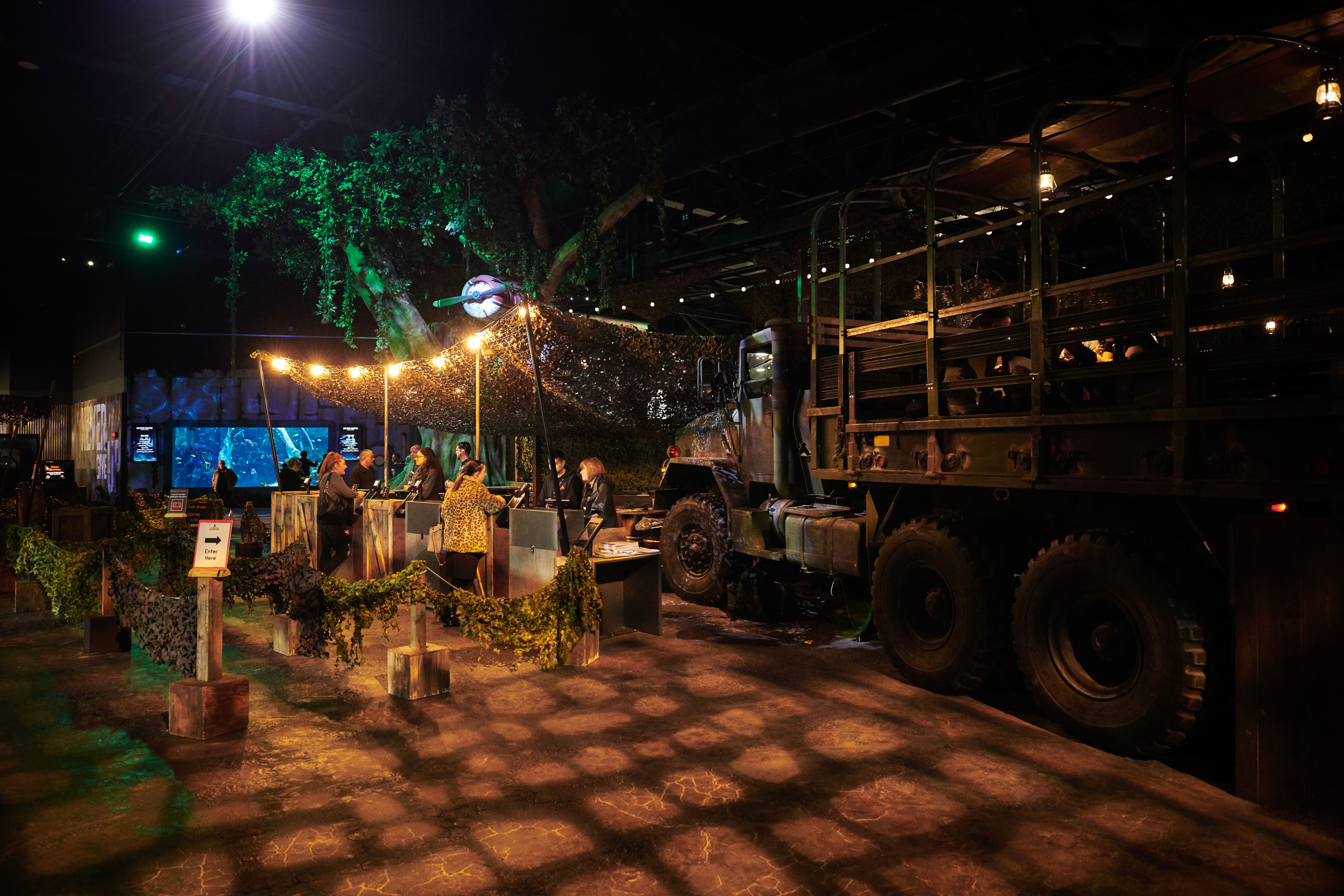 The Bear Grylls Adventure main admissions entrance area with army truck and rain forest tree