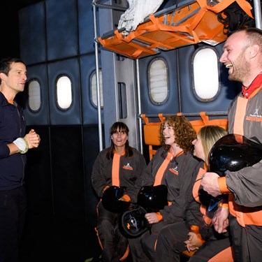 Bear Grylls talks to guests at The Bear Grylls Adventure