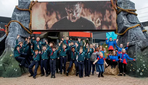 Group of scouts post by The Bear Grylls Adventure entrance