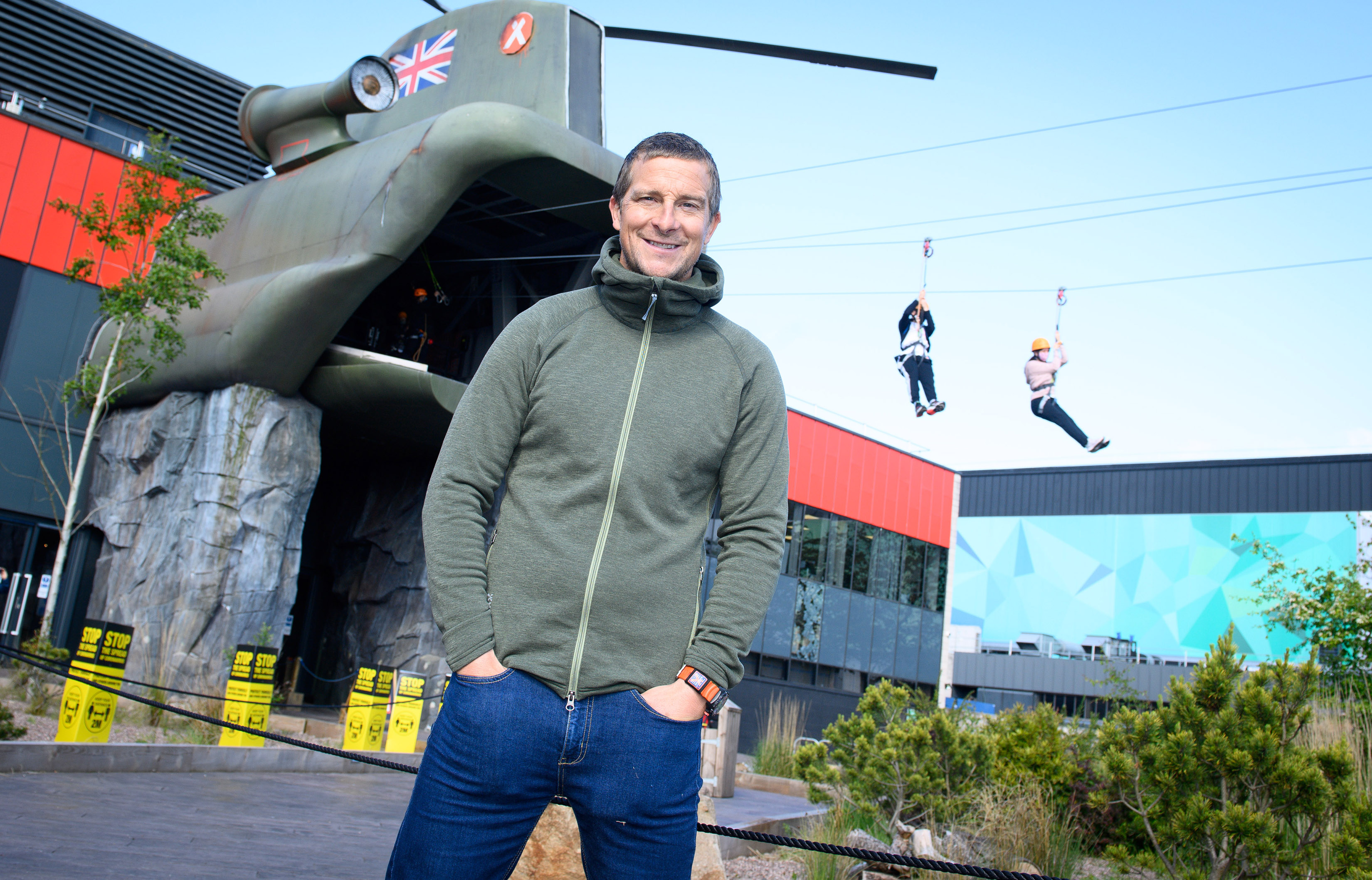 Bear Grylls outside The Bear Grylls Adventure