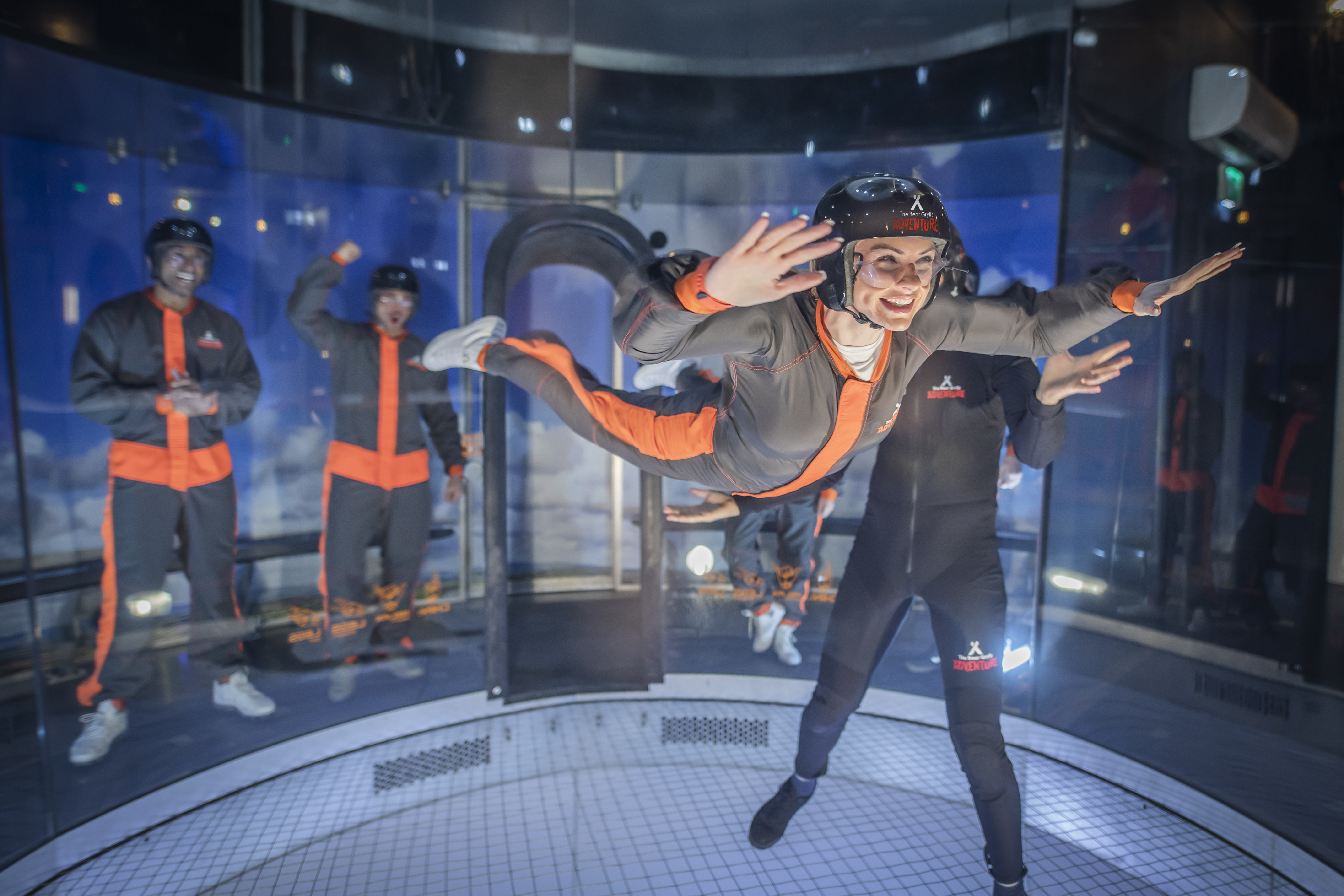 Woman flies in iFLY indoor skydiving tunnel at The Bear Grylls Adventure Birmingham
