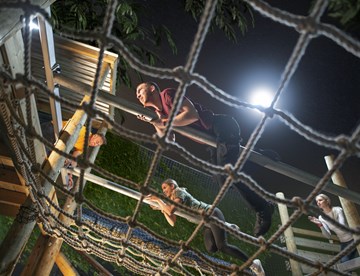 Group of friends on obstacle on Assault Course at The Bear Grylls Adventure